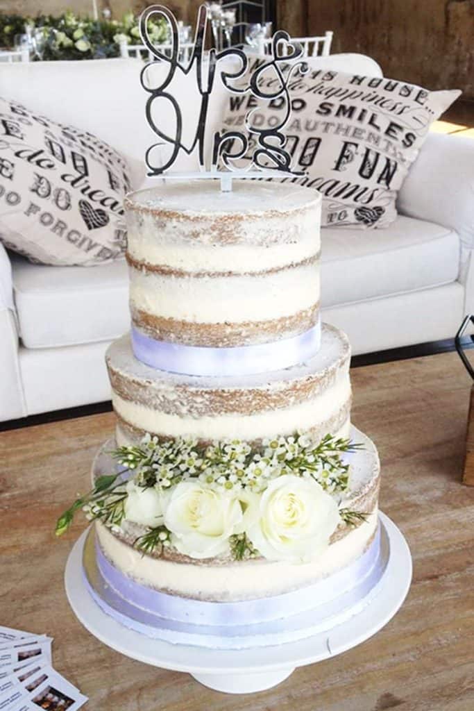 Elegant semi naked wedding cake with fresh roses in Howick KZN Midlands