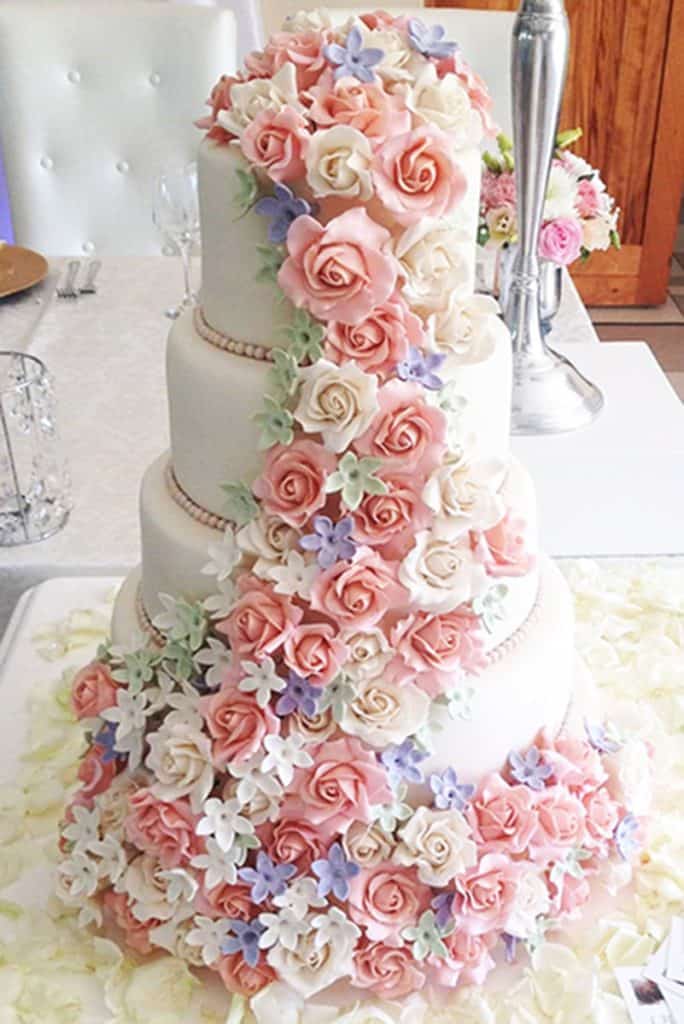 Beautiful white wedding cake with pink and white sugar rose cascade in Howick KZN Midlands