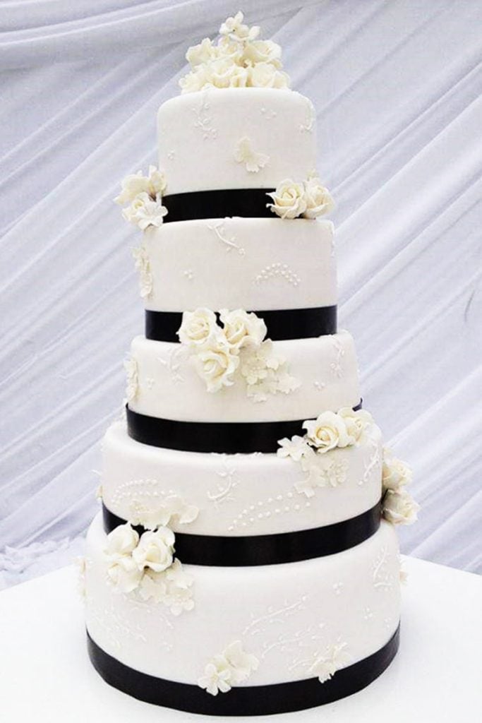 Beautiful white wedding cake with pink and lilac rose cascade in Howick KZN Midlands