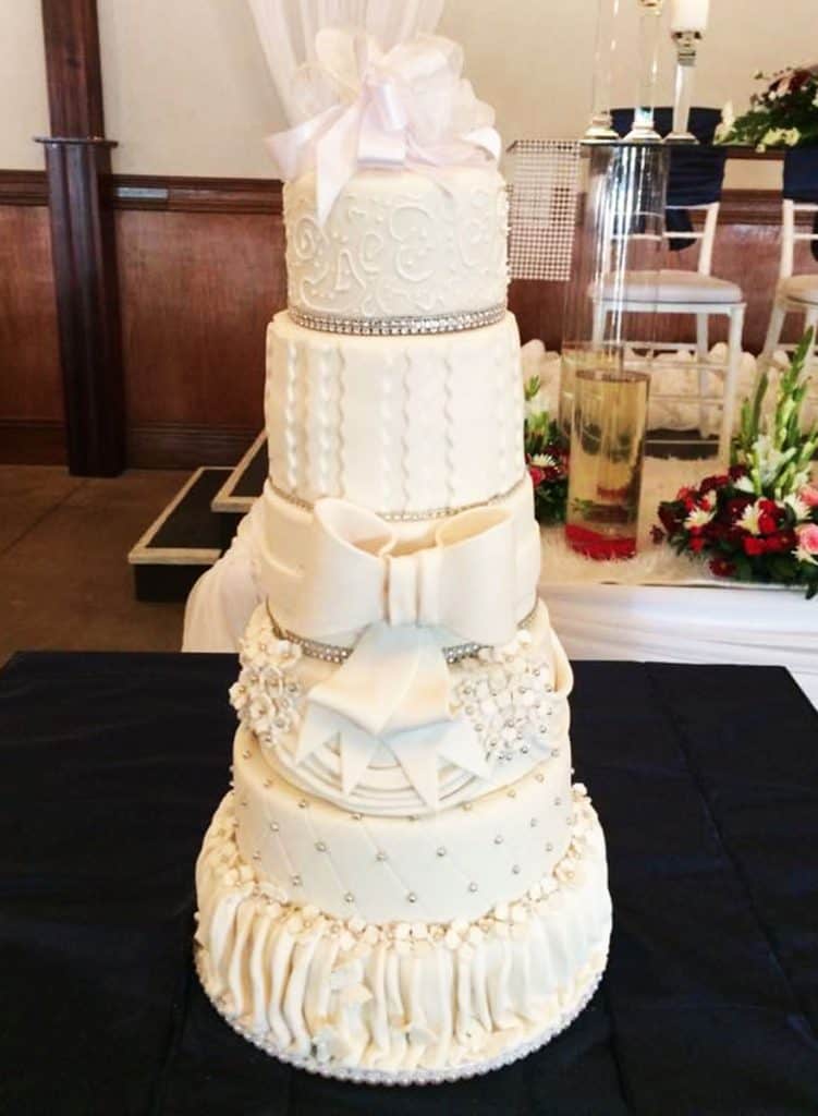Six tier classical white wedding cake by Flour Of Love Wedding Cakes in Howick KZN Midlands