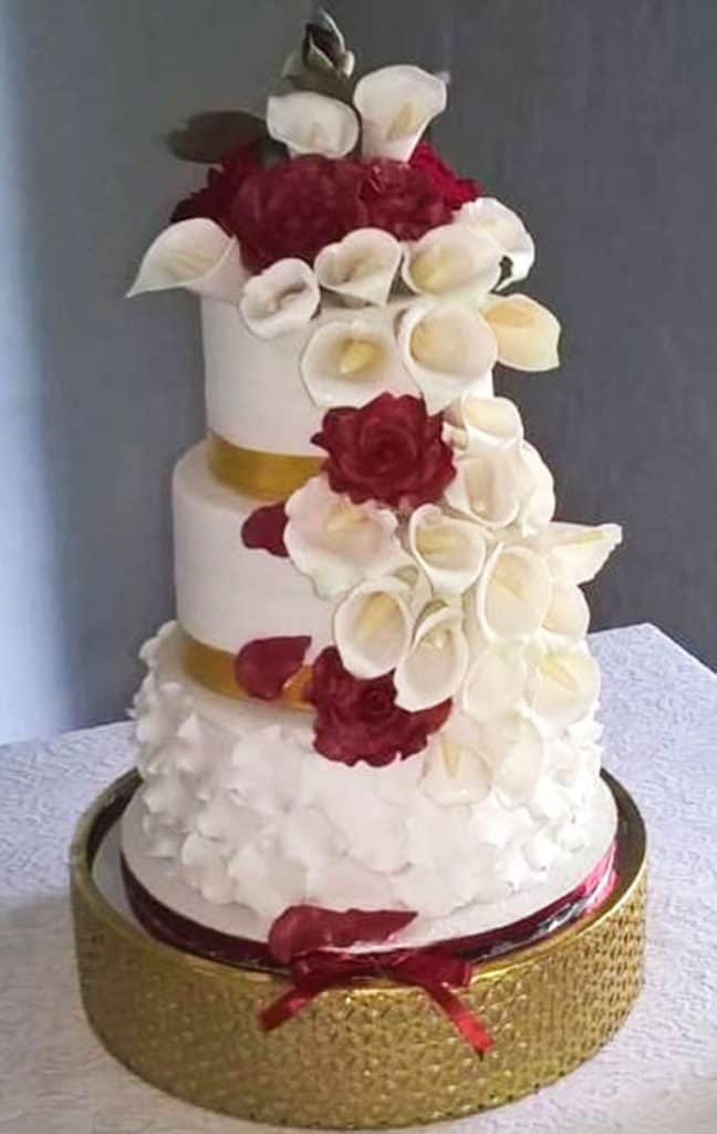 White and red wedding cake with sugar arum lilies in Howick KZN Midlands